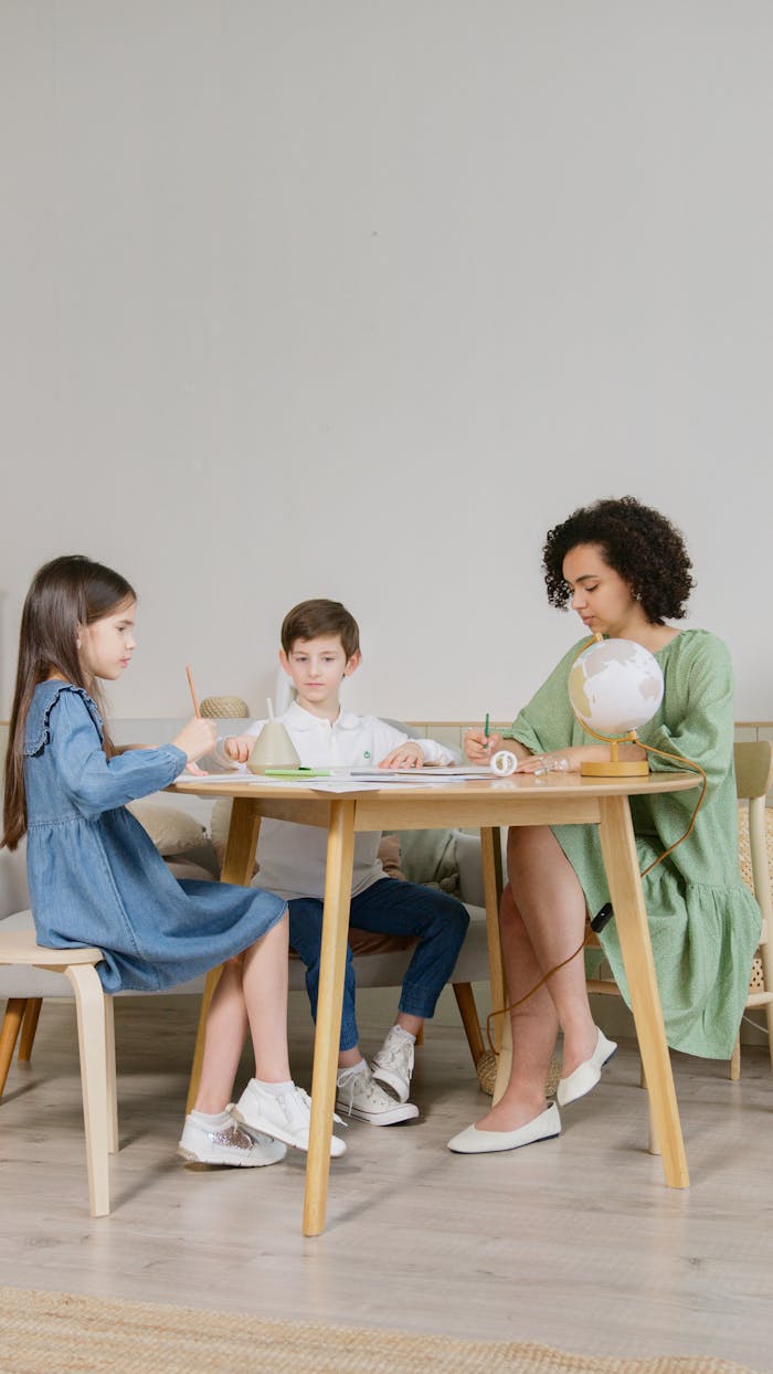 cta-02 A teacher engages young students in classroom activities, promoting learning and interaction.
